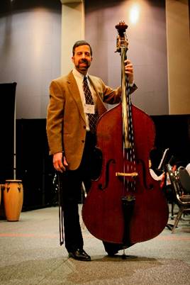 A person standing in front of a instrument

Description generated with very high confidence